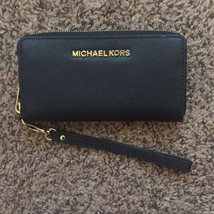 Selling MK wristlet